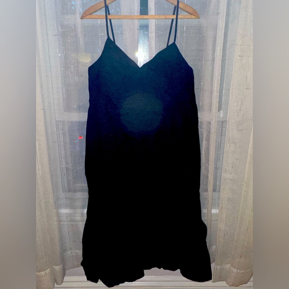 Black gap maxi dress. Thin straps with an open back and ruffle at the hem.